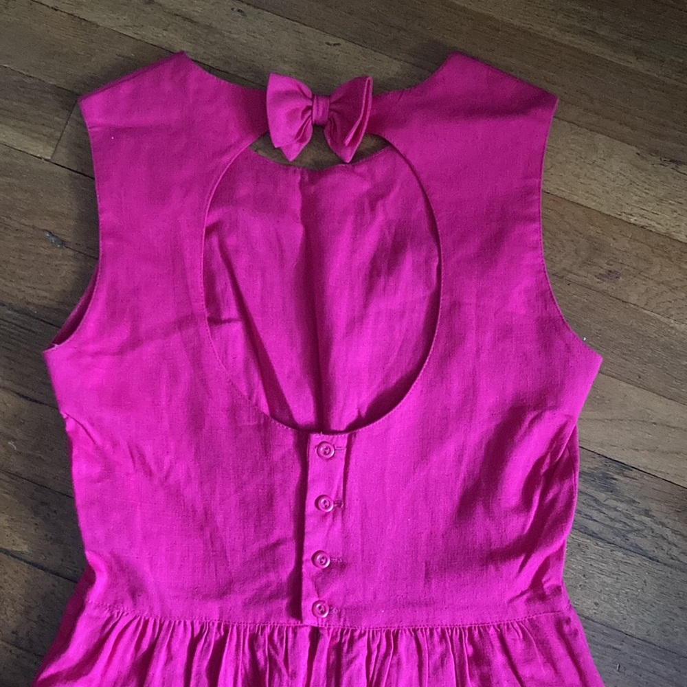 Hot pink linen midi dress with cutout back and bow